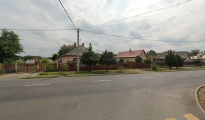 Lakóházak utcaképe, temetkezési szolgáltatásokhoz kapcsolódó kép.