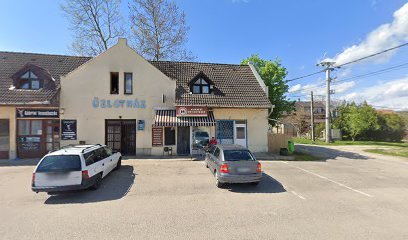 Temetkezési szolgáltató iroda épülete parkolóval.