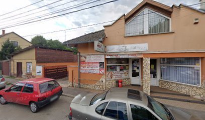 Temetkezési szolgáltató iroda épülete, parkoló autókkal.