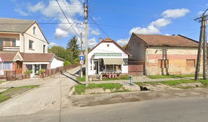 Virágüzlet utcaképben, temetkezési szolgáltatásokhoz kapcsolódóan.