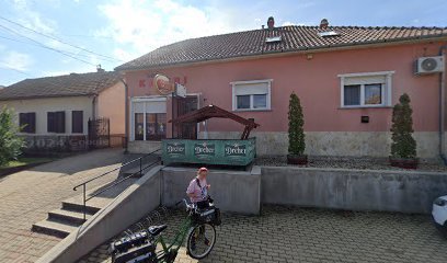 Temetkezési szolgáltató iroda épülete, kerékpáros a bejárat előtt.