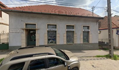 Temetkezési szolgáltató iroda épülete, kirakatokkal.